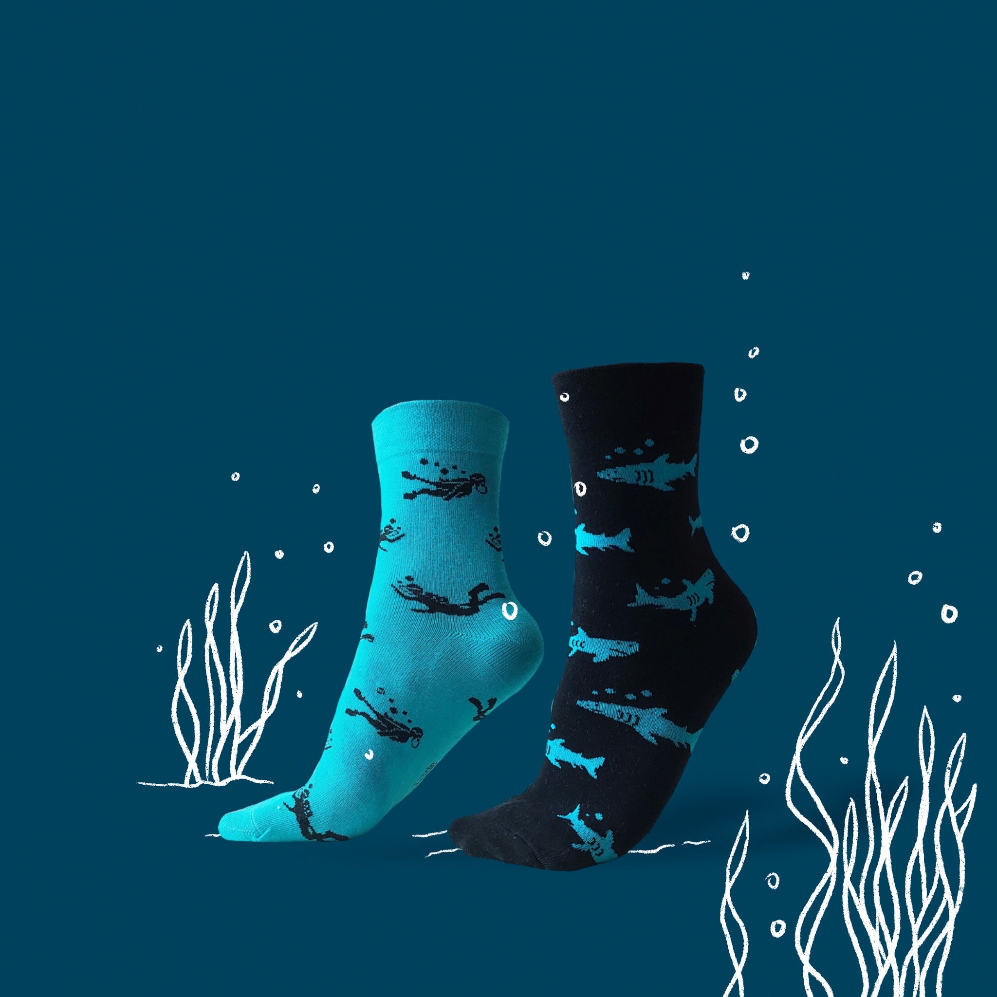 Shark and scuba diver socks. Organic Cotton socks. Odd socks paired with a story. Why should your left foot look like your right? socks that's fun, socks that are unique gifts. 